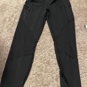 Black athleta leggings with breathable legs and pockets